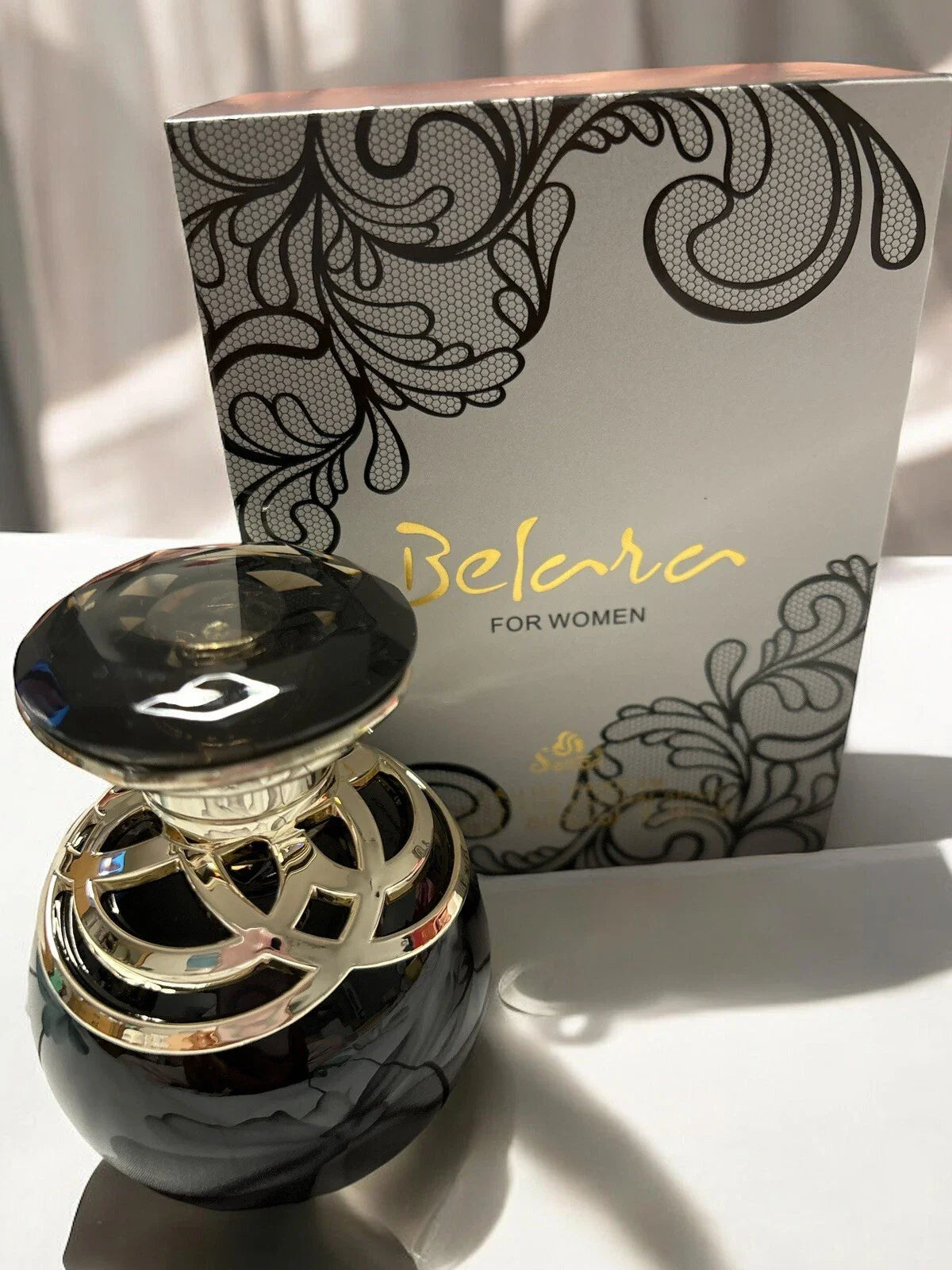 Belara Perfume Black fragrance packaging and spray bottle