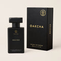 Black Oakcha perfume bottle and packaging on a beige background