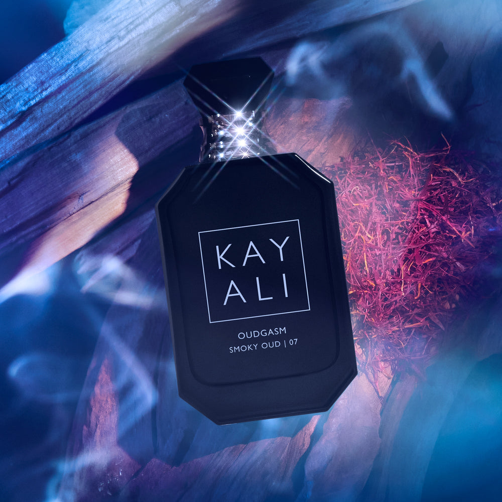 Black perfume bottle labeled 'KAY ALI' with a mystical background