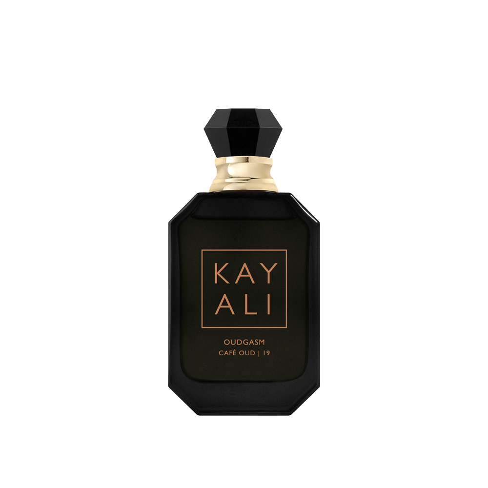 Black perfume bottle with gold accents on a white background