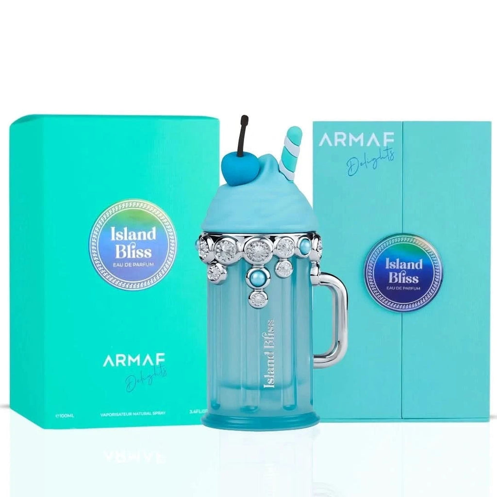 Blue perfume bottle with cherry on top and 'Island Bliss' packaging against a white background