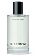 Clear bottle with black cap labeled 'Salt & Stone' on a white background