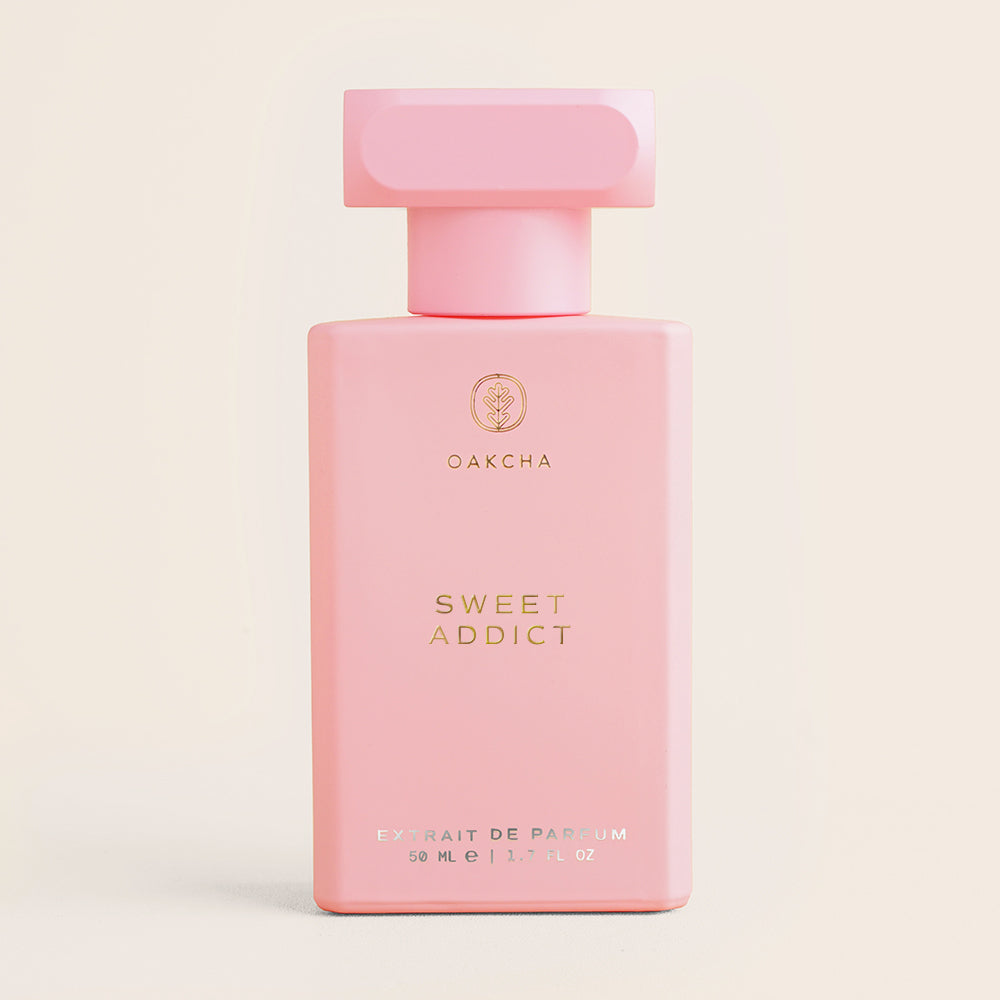 Pink perfume bottle labeled 'Chic Treat' by OakCha on a light beige background