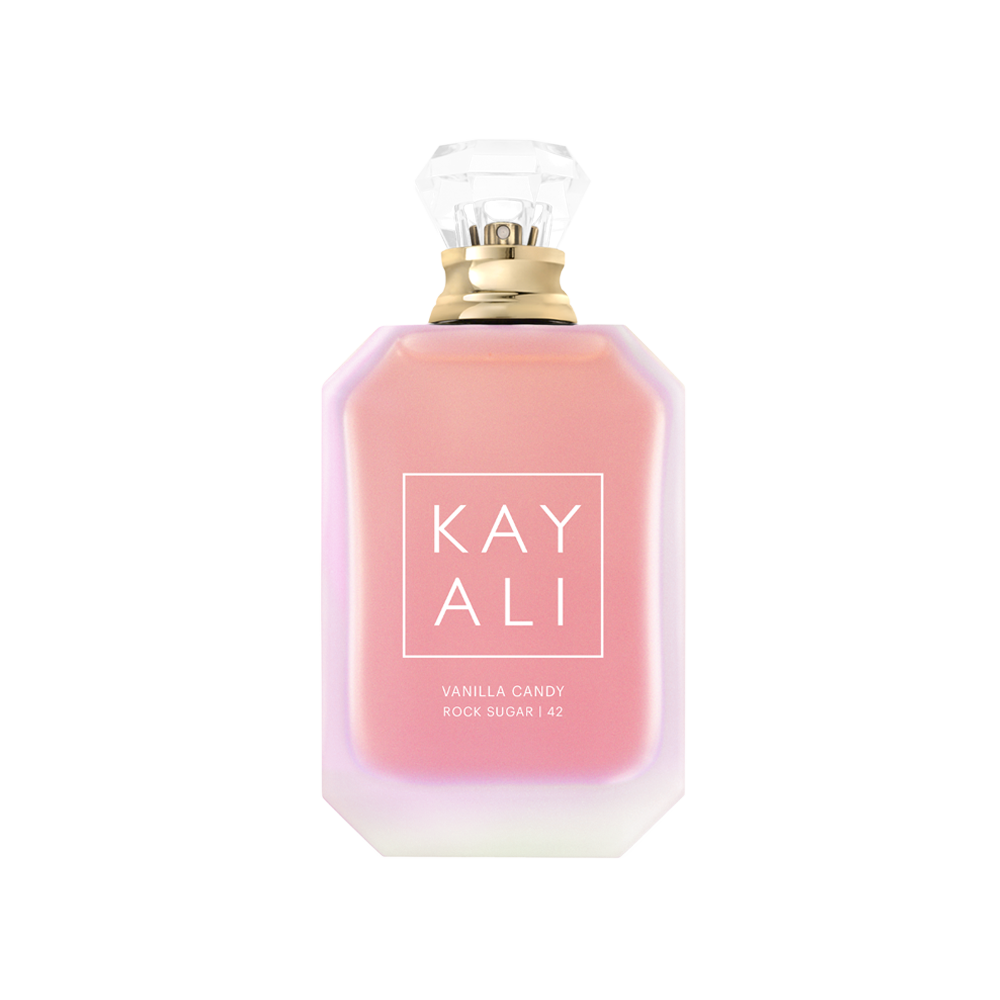 Pink perfume bottle with gold cap on a white background